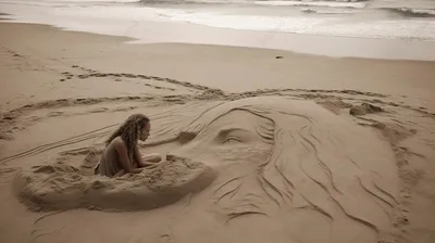 Девушка лежит на песке, на пляже Stock Photo | Adobe Stock