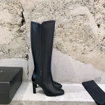 Сапоги Yves Saint Laurent Цвет: Чёрный купить по цене 40000 руб. арт. 54666