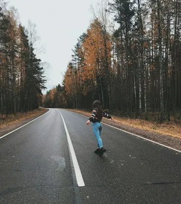 Девушка в джинсах на дороге у машины Stock Photo | Adobe Stock