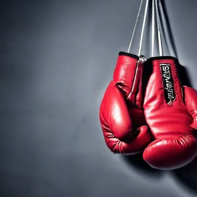 Боксерские перчатки весят на черной …» — создано в Шедевруме