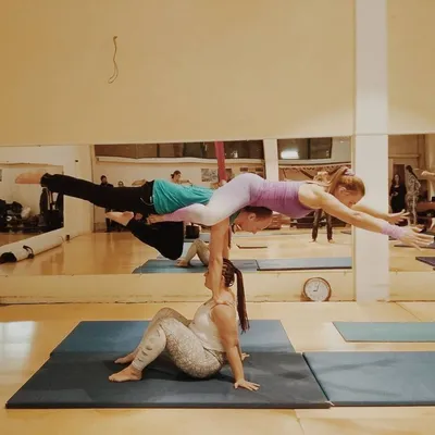 Three Young Women Practicing Acro Yoga in White Studio. Stock Photo - Image  of adult, human: 99889668